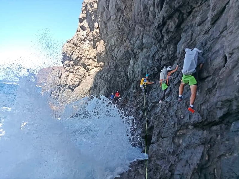 Agaete: Gran Canaria Coasteering. Marine Ferrata and Zipline - Sea-level climbing and the chain pass: learning technique on real rock